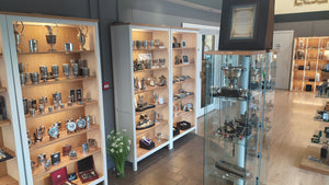 The Pewter Gallery at Mullingar pewter. A collection of fine pewter products on display in white cabinets and displaying the collection of Mullingar Pewter. 