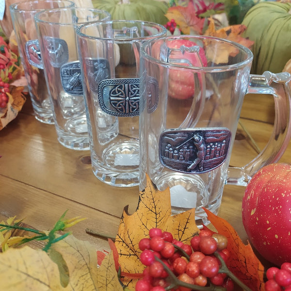 Collection of Glass Beer tankards with handle and pewter embellishment  with various scenes such as golf, racing, celtic art and claddagh.
