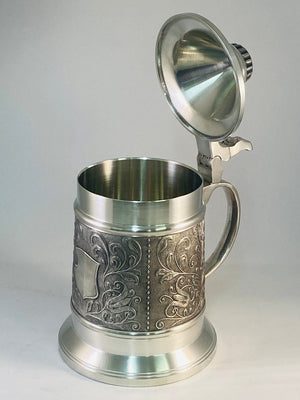 BEER STEIN WITH PAISLEY DESIGN. THIS BEAUTIFUL STEIN IS 7" TALL 170 MM. THE CAPASITY IS 1 PINT OR OVER HALF A LITRE.  tHE DECORATION RUNS AROUND THE BODY OF THE TANKARD AND HAS A BEEADED LID. PEWTER/SILVER FINISH WITH DARKENED BACKGROUND