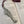 Load image into Gallery viewer, REPLICA OF JAMES JOYCE AS A BOOKMARK WITH Maroon Tassel attached. MADE OF PEWTER METAL IN SILVER FINISH MADE IN IRELAND.