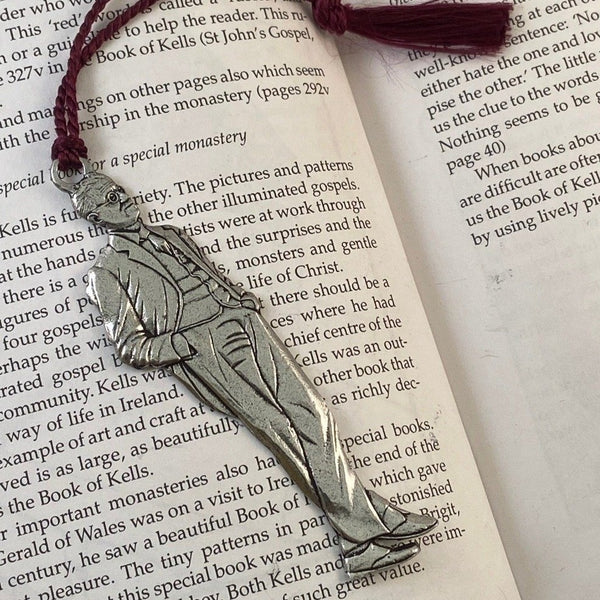 REPLICA OF JAMES JOYCE AS A BOOKMARK WITH Maroon Tassel attached. MADE OF PEWTER METAL IN SILVER FINISH MADE IN IRELAND.