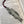 Load image into Gallery viewer, REPLICA OF W.B. YEATS AS A BOOKMARK WITH A PURPLE TOSSEL ATTACHED.MADE OF PEWTER METAL IN SILVER FINISH MADE IN IRELAND.
