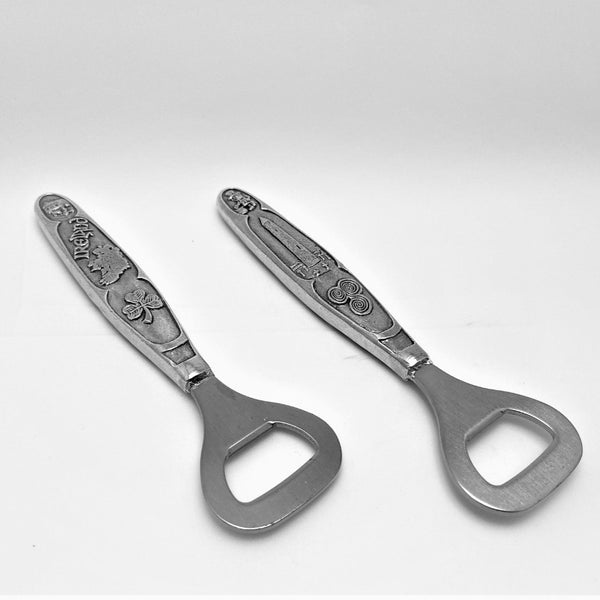 IRELAND BOTTLE OPENER WITH SCENES OF IRELAND ON PEWTER HANDLE AND SILVER COLOUR STAINLESS STEEL METAL OPENER . the pewter handles ar about 4" long and have designs of Round Tower, Map of Ireland, Shamrock, Celtic Spiral and leprechaun.
