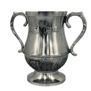 WEDDING LOVE CUP CLADDAGH DESIGN. The Claddagh love cup is used by the Bride and Groom to toast each other and to signify their unity, each having a handle to drink with, but each drinking from the same cup.. the bowl of the Cup is surrounded with Celtic design. The cup stands at 6" tall. and makes a great engagement or wedding gift. Handmade in Ireland by Mullingar Pewter. 