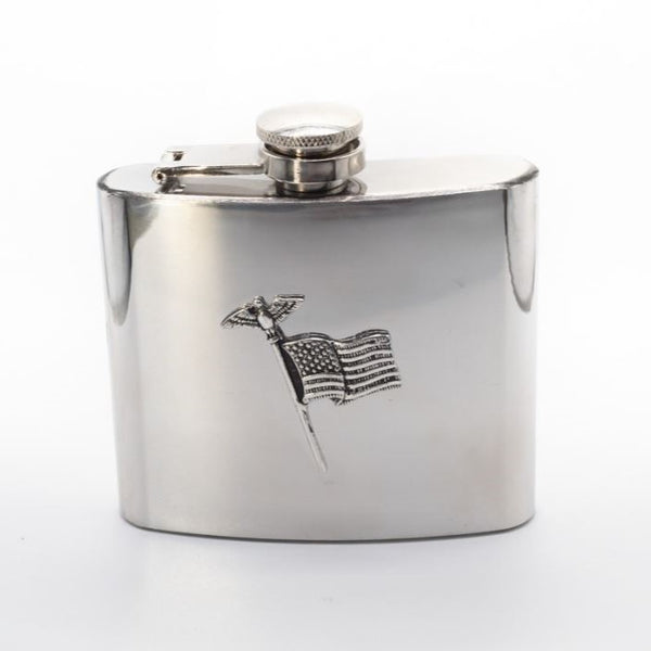Stainless steel Hipflask with American Flag pewter decoration. The flask is 3" tall and hip shaped. Holding 5 fluid ozs. it makes for a great warmer upper when attending a winter sporting occasion. The American flag staff with the stars and strips and American Eagle make for a great look. Made in Ireland by Mullingar Pewter