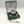 Load image into Gallery viewer, Mullingar Pewter Mechanical Pocket Watch, which opens to reveal the full watch face. Embellished with Pewter decor, shamrocks. Accompanied by pewter shamrock cufflinks. Presented in a Green Gift Box.