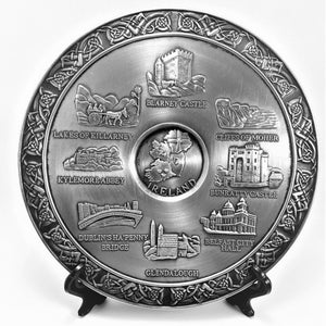 IRELAND PLATE 8 INCH DIAMETER. PEWTER METAL FINISH WITH SILVER LOOK CENTRE. The plate is surrounded with Celtic Knotwork and the plate has scenes of Ireland. Blarney Castle, Cliffs of Mohar, Glendalough, Kilarney,  Kylemore Abbey, Dublin, Belfast, Bunratty Castle and Ireland map. 