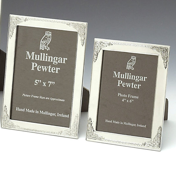 KELLS FRAMES WITH DESIGN THAT HAS BEEN INSPIRED BUY THE BOOKS OF DURROW AND KELLS. THE DECORATION CAN ALSO BE  SEEN ON MANY OF IRELANDS HIGH CROSSES. THE FRAMES ARE IN TWO SIZES 5" X 7" AND 4" X  6". THEY ARE POLISHED TO A HIGH FINISH WITH A SOFT SILVER FINISH. THE FRAMES HAVE A STRONG FRAME BACK AND MAKE A GREAT GIFT FOR ANY OCCASSION. PEWTER