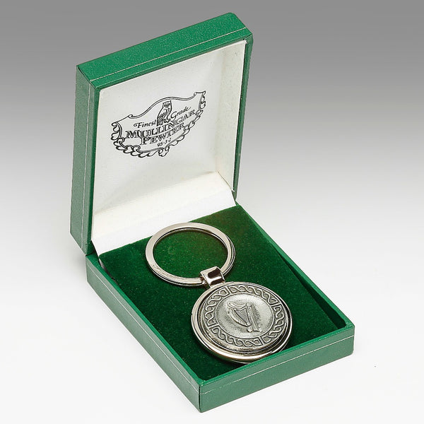 KEY CHAIN HARP DESIGN. tHE HARP IS THE NATIONAL SYMBOL OF IRELAND AND IS OFTEN PLACED SECOND TO THE SHAMROCK. THE HARP DESIGN IS SURROUNDED BY CELTIC DESIGN AND IS PLACED IN A BEAUTIFUL PENDENT BOX WITH GREEN VELVET FINISH. THE KEYCHAIN HAS A SOFT PEWTER SILVER FINISH. EWTER SILVER METAL