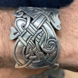 CELTIC MENS CUFF FROM ANCIENT IRISH MANUSCRIPT DESIGN THE INTERTWINED DRAGON AND BIRD LIKE CREATURES WERE THE INVENTION OF MONKS FROM THE 8TH AND 9TH CENTUARY.. PEWTER/ SILVER METAL