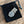Load image into Gallery viewer, The T4 Money Clip by Mullingar Pewter sitting on a black velvet bag.