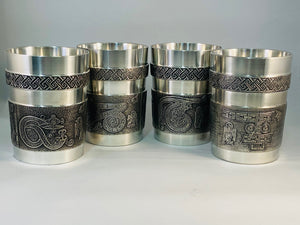 SET OF 4 BOOK OF KELLS BEAKERS. EACH BEAKER HAS A LETTER FOR THE CELTIC MANUSCRIPT. THE BEAKERS ARE 4" HIGH AND EACH HAS A CAPACITY OF 10OZ. PEWTER SILVERWARE FINISH. HANDMADE IN IRELAND.