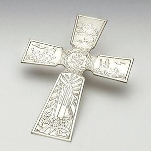PT.PATRICK CROSS. The cross tells the story of St.Patrick, his captivity, slavery in Ireland minding sheep, his return to Ireland and how he rid Ireland of snakes. the cross is 8" long and comes with a hanger. This pewter wall mounted cross makes a great house warming gift for any Irish family. Hand made in Ireland