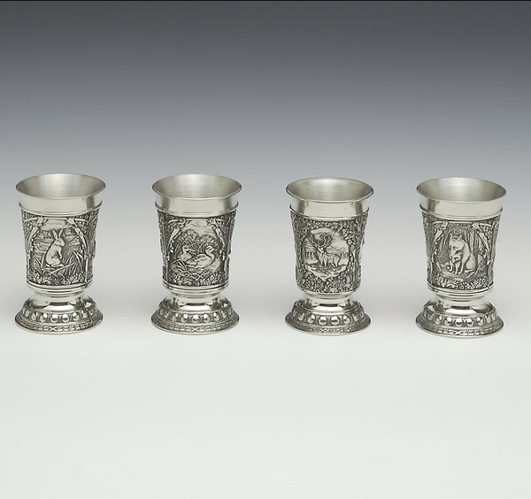 handcrafted pewter shots with woodland scenes depicted on them. Hare, Duck, Deer and fox. Each measure is 2" tall and holds 1 fluid oz. Great fathers day gift. Handmade in Ireland by Mullingar Pewter