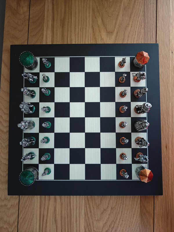 Battle of the Boyle Pewter Chess set on wooden board, top view