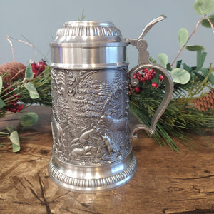 Beautiful pewter stein drinking tankard which is decorated with woodlands scene of Stag, foxes and boar. 
