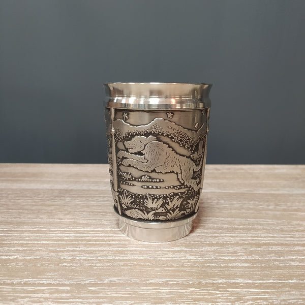 Pewter silver coloured beaker depicting the hound of Culainn legend