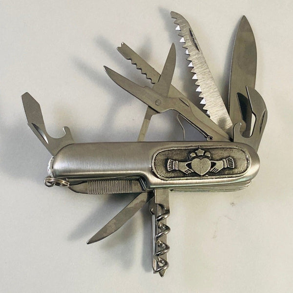 ARMY MULTI TOOL KNIFE. GREAT FOR THE OUTDOORS, CAMPING ETC. THE LAONGEST BLADE IS 3" LONG AND THE OUTER CASE HAS THE CLADDAGH DESIGN FIXED TO THE SIDE.
