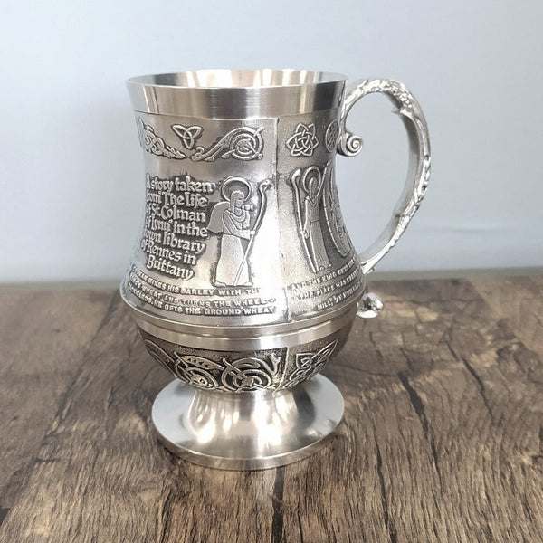 ST COLMAN TANKARD tells the story of how Mullingar got its name. Saint Colman was a local saint and widely regarded as the founder of Mullingar. Our tankard is 6" high and holds 18 fluid oz. Pewter in soft silver finish. Handmade in Ireland