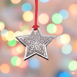 Silver coloured Pewter metal Star Christmas Decoration with red ribbon