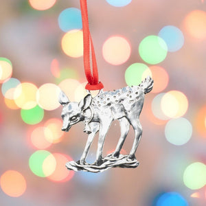 Baby fawn christmas decoration made of pewter with a red ribbon