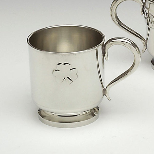 PEWTER METAL BABY CUP WITH SHAMROCK DESIGN. PERFECT AS A BABY GIFT AND EASY TO PERSONALISE. PEWTER IS LOVELY TO ENGRAVE AND THE METAL HOLDS THE SILVER SHINE. PEWTER CUP MADE IN IRELAND