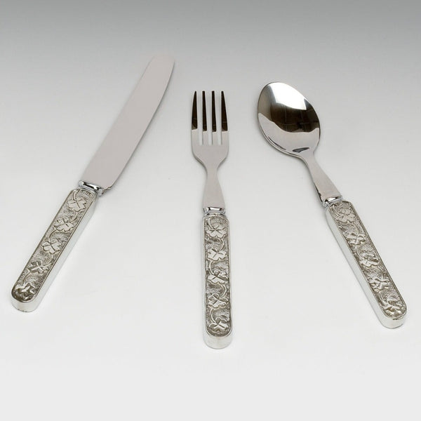 BABY KNIFE FORK AND SPOON SET IN SHAMROCK DESIGN. THE HANDLES ARE PEWTER METAL AND THE BLADES ARE STAINLESS STEEL. THE DESIGN ON THE PEWTER IS SHAMROCK TRELLIS. SILVER FINISH MADE IN IRELAND