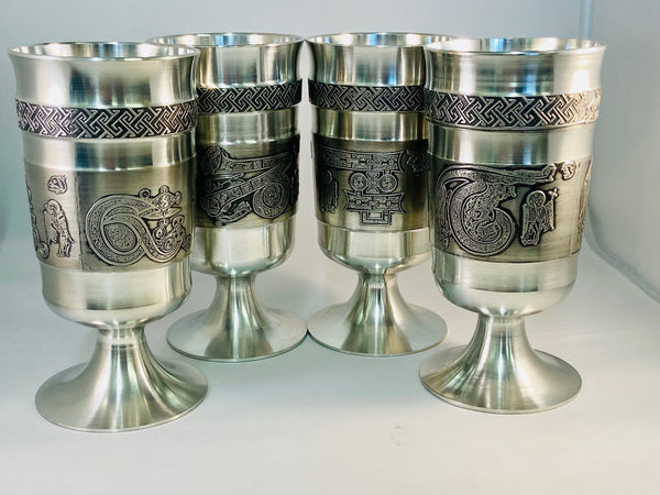 A SET OF 4 CELTIC LETTER GOBLETS T,ET,IP AND Z. THE GOBLETS ARE ALL HANDCAST AND THEN TURNES BY HAND OUTSIDE AND INSIDE. THE CELTIC LETTERS ARE ALSO ACCOMPANIED WITH CELTIC TYPE CREATURES THAT REPRESENT SAINTLY FIGURES THAT THE MONKS OF THE 8TH AND 9TH CENTURIES DREW ON MANUSCRIPT IN KELLS AND IONA. THE GOBLETS HAVE A LOVELY SOFT SILVER FINISH AND HAVE CELTIC SURROUND DESIGN. ÉTAIN, ZINN ,HARTZINN, PELTRO METAL