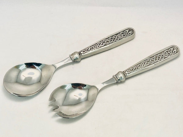 SALAD SERVER SET WITH CELTIC  DESIGN HANDLES MADE OF PEWTER. STAINLESS STEEL SPOONS ALL WITH SILVER LOOK FINISH.  Both are 9" long and polished to silverware finish