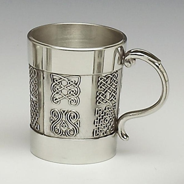 2 OZ CELTIC SHOT WITH HANDLE. CELTIC DESIGN FROM BEALIN CROSS. MADE OF PEWTER METAL WITH SILVER FINISH AND MADE IN IRELAND. 