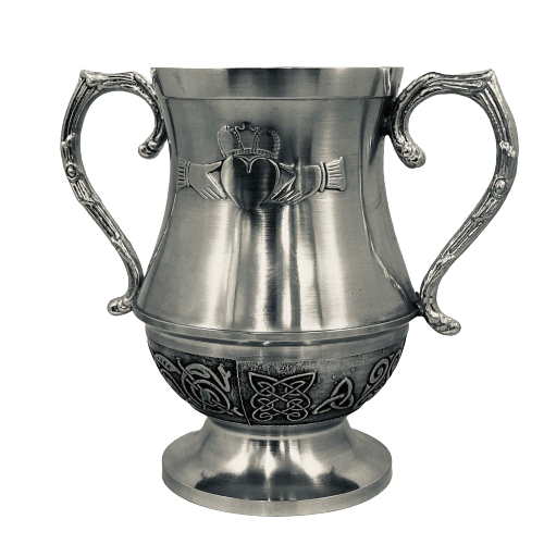 WEDDING LOVE CUP CLADDAGH DESIGN. The Claddagh love cup is used by the Bride and Groom to toast each other and to signify their unity, each having a handle to drink with, but each drinking from the same cup.. the bowl of the Cup is surrounded with Celtic design. The cup stands at 6" tall. and makes a great engagement or wedding gift. Handmade in Ireland by Mullingar Pewter. 