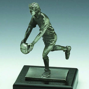GAELIC FOOTBALLER. Pewter finish gaelic player about to kick the ball. Great for young player of the year. 6" tall. Handmade in Ireland
