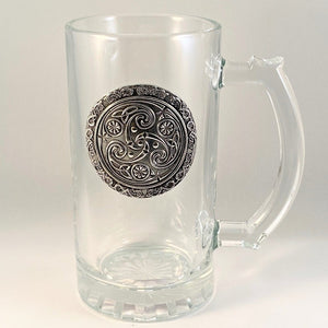GLASS TANKARD WITH PEWTER METAL EMBLEM with Celtic design triclad and Celtic design surround. 15oz capacity and 6" tall.