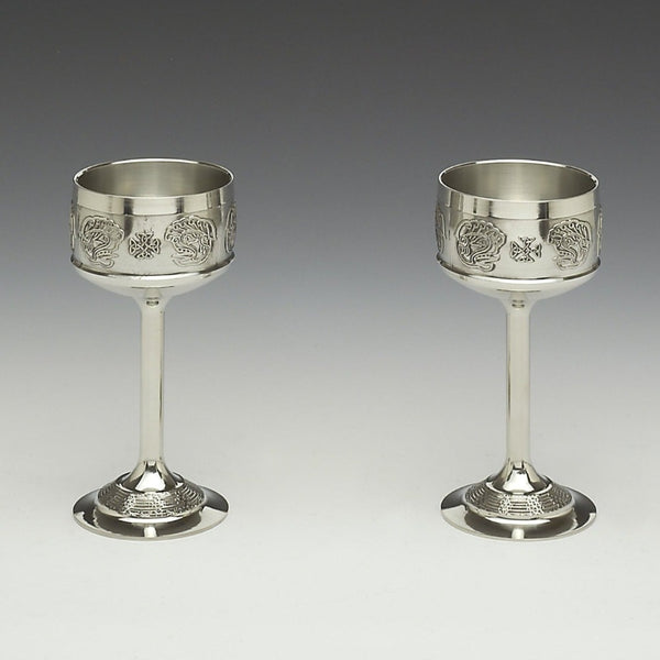 SET OF 2 HOCK GOBLET WITH CELTIC DRAGON INSPIRED BY OLD IRISH MANUSCRIPT. THE DECORATION ON THE FOOT IS CELTIC LACE AND EACH GOBLET IS POLISHED TO SILVERWARE FINISH. EACH GOBLET IS 7" TALL. CAST PEWTER , JUST SO ELEGENT AND STYLISH TO SIP A NICE WINE ON A WARM EVENING. HANDMADE IN IRELAND