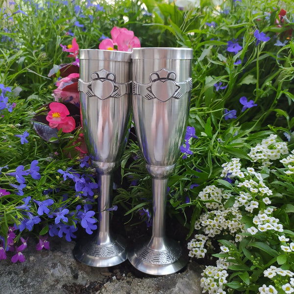 Handcrafted Pewter champagne flute.  Embossed with the popular claddagh emblem. surrounded by blue, pink and white flowers