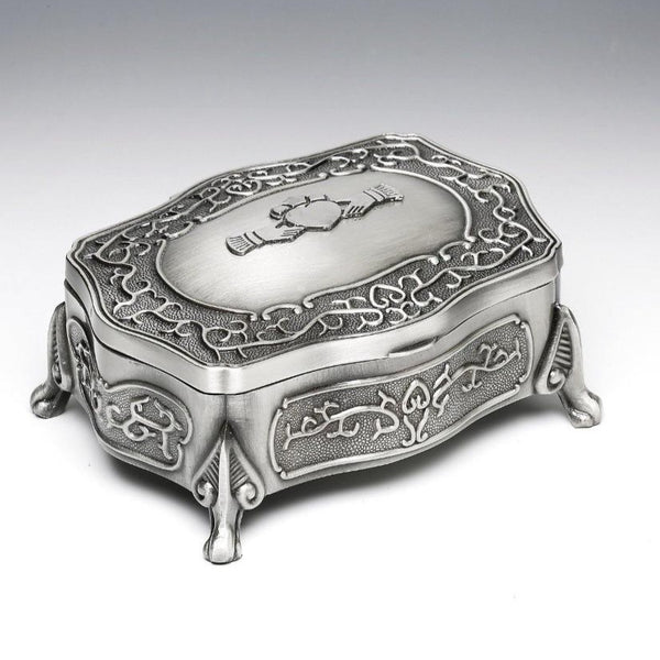 CLADDAGH JEWELLERY BOX WITH CELTIC SCROLL AND DELICATELY APPOINTED LEGS. The Pewter claddagh is fixed to the top of the box. 