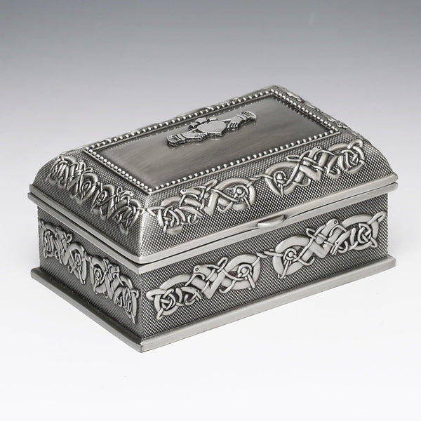 3 1/2 INCH LONG JEWELLERY BOX WITH CLADDAGH AND CELTIC DESIGN. OUR MEDIUM SIZE BOX IS PERFECT AS A GIFT AND WILL BE CHERISHED BY A LOVED ONE. THE BEAUTIFUL CELTIC PATTERN AND THE CLADDAGH LID SIT SO WELL TOGETHER. PEWTER SILVER METAL FINISH