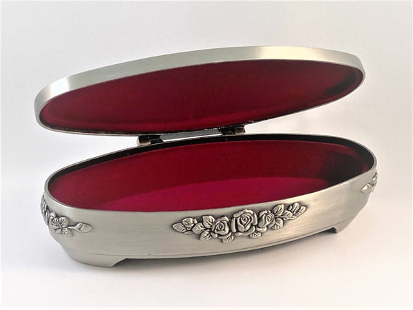 JEWELLERY BOX OVAL CLADDAGH. THE BOX IS 6 1/2" LONG AND HAS A LOVELY SOFT VELVET INTERIOR. 