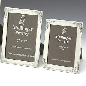 KELLS FRAMES WITH DESIGN THAT HAS BEEN INSPIRED BUY THE BOOKS OF DURROW AND KELLS. THE DECORATION CAN ALSO BE  SEEN ON MANY OF IRELANDS HIGH CROSSES. THE FRAMES ARE IN TWO SIZES 5" X 7" AND 4" X  6". THEY ARE POLISHED TO A HIGH FINISH WITH A SOFT SILVER FINISH. THE FRAMES HAVE A STRONG FRAME BACK AND MAKE A GREAT GIFT FOR ANY OCCASSION. PEWTER 
