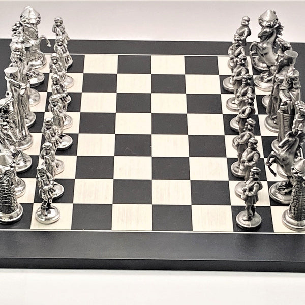 MEDIEVAL CHESS SET. EACH PIECE IS SO LIFE LIKE AND ARE A TREAT TO PLAY WITH. THEY ARE WEIGHTY AND ADD TO ANY GAME OF CHESS. HANDMADE IN MULLINGAR IRELAND OF PEWTER. PEWTER/ SILVERWARE FINISH. BOARD IS 14" SQUARE.