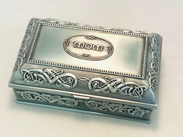 5" LONG JEWELRY BOX WITH CELTIC KNOTWORK OF WILD BIRD LIKE CREATURES. THE LID IS BEADED AND IN THE CENTER IS THE WORD MOM. THE BOX IS POLISHED TO A SOFT PEWTER SILVERWARE SHEEN. A GREAT GIFT FOR MOTHER ON ANY OCASSION.