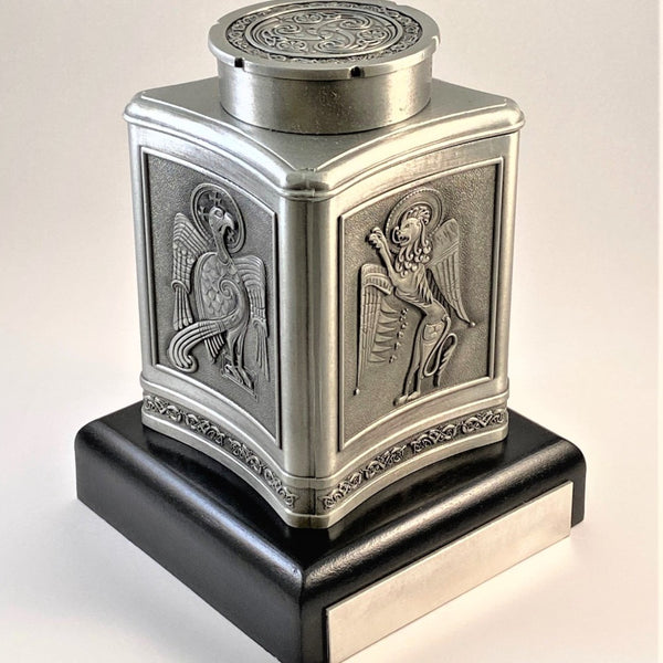 MINI KEEPSAKE URN FOR A LOVED ONES ASHES MADE OF PEWTER METAL IN SOFT SILVER FINISH WITH BEAUTIFUL CELTIC DESIGN . the base can be easily engraved with loved ones details.