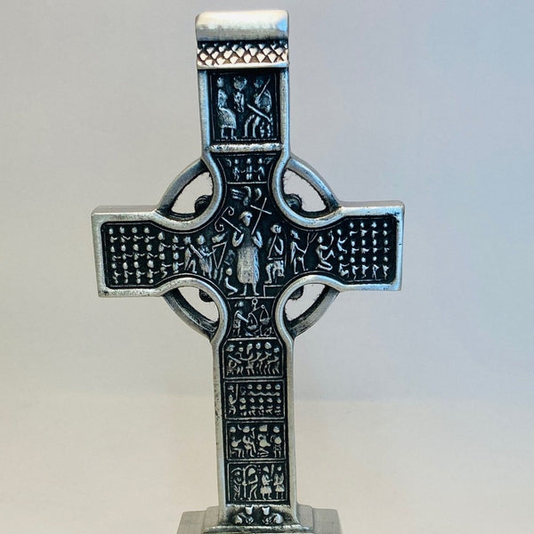 Replica of Muiredach High Cross. THIS REPLICA STANDS 7" HIGH AND IS AN EXACT COPY OF THE ORIGINAL. PEWTER/SILVER FINISH WITH POLISHED SIDES AND BASE.