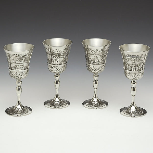 Set of 4 Mythical Irish wine Goblets with Celtic design stem and bowl. Each goblet is 8" tall and the goblets have a capacity of 8ozs. The goblets each have a story embossed on the bowl. Brian Buro, Queen Maeve, King Lugh and Na Fianna. Pewter with Polished silverware finish. HANDMADE IN IRELAND