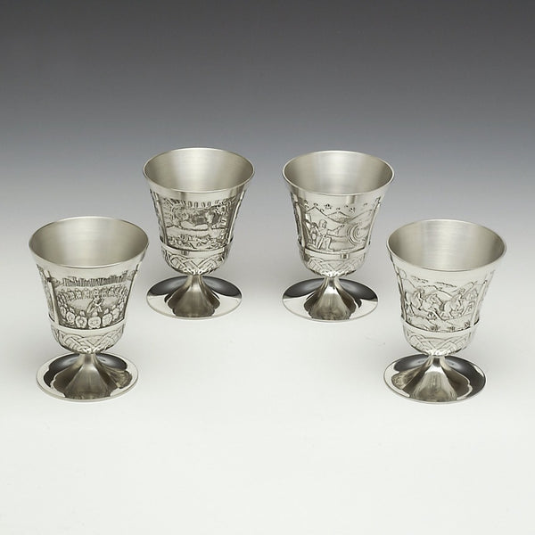 SET OF 4 MYTHICAL IRISH TUMBLERS. EACH WINE TUMBLER IS 4" TALL AND HAS A CAPICTY OF 8OZS. THE TUMBLERS ARE EMBOSSED WITH STORIES OF IRELAND. BRIAN BORU, QUEEN MAEVE, KING LUGH AND NA FIANNA. PEWTER SILVERWARE FINISH. HANDMADE IN IRELAND