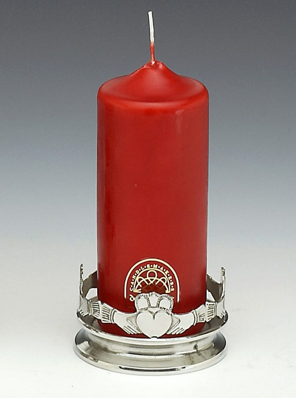 CANDLE HOLDER WITH CLADDAGH SURROUND MADE OF PEWTER. THE BASE IS SOLID AND HAS THE CLADDAGH AT 3 1/2" DIAMETER. 