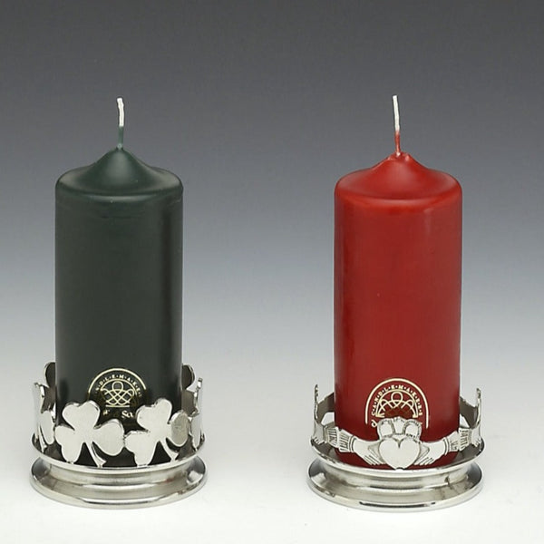 CANDLE HOLDERS. ONE WITH SHAMROCK SURROUND AND ONE WITH CLADDAGH SURROUND. MADE OF SILVER FINISHED PEWTER WITH CANDLES