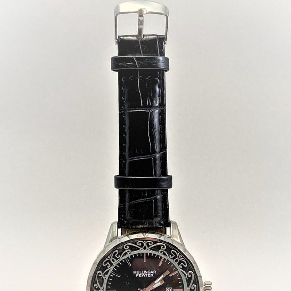 Mens wrist watch with leather strap and silver polished face.