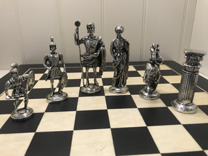 CHESS SET OF ROMAN FIGURES. Great Chess sets are even better when played with weighty pewter figures and each piece looks like a real King, Queen Bishop, Knight Castle and Pawn. The king is 3 3/4" tall and the pawn is 2 1/4" tall. The board is 14" square.