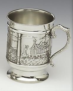 ST.COLUMCILLE TANKARD. THIS TANKARD TELLS THE STORY OF  ST. COLUMCILLE AND THE MONASTIC SETTLEMENTS  HE BUILT THROUGHOUT IRELAND. THE TANKARD IS OVER 4" TALL AND HOLDS 18OZ. HANDMADE IN IRELAND
